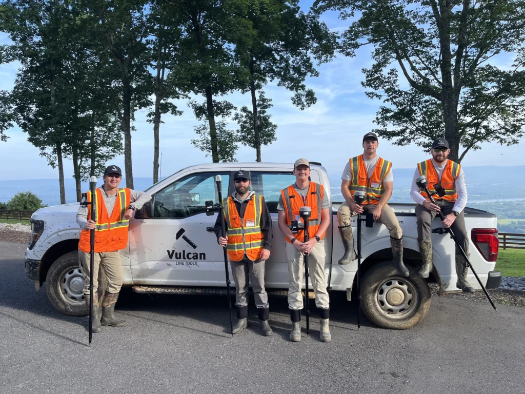 Surveyors equipped with Reach GNSS receivers 