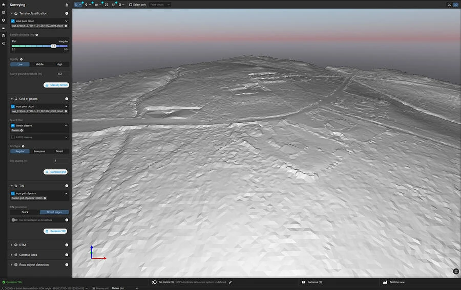 3D terrain surface model generated from drone survey data, showing a triangulated digital terrain model (TIN) with visible excavation features, embankments, and access tracks in a photogrammetry software interface.